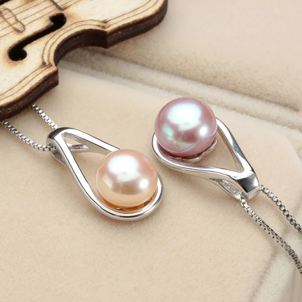 Lustrous Pearl Drop Pendant with Sparkling Cubic Zirconia in Sterling Silver